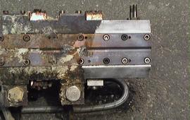 Cleaning hotmelt nozzle systems