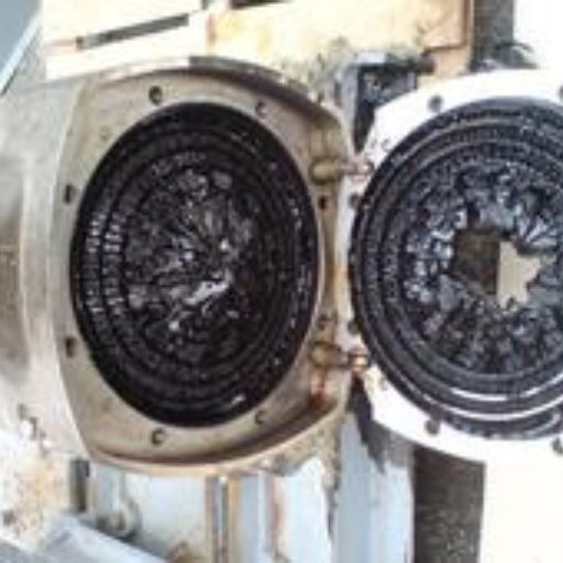 Removing carbon deposit from production equipment