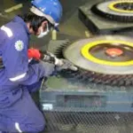 Cleaning with dry ice and abrasives at power plants