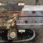 Cleaning hotmelt nozzle systems
